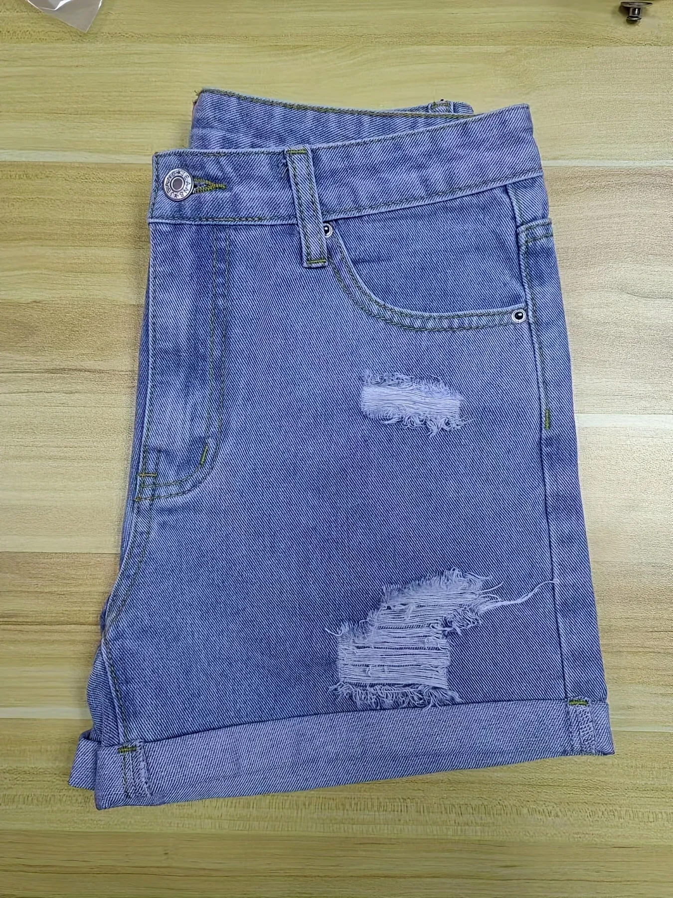 Trendy Blue Denim Shorts with Chic Ripped Details & Rolled Hem - Durable, Casual Wear for Fashion-Forward Women